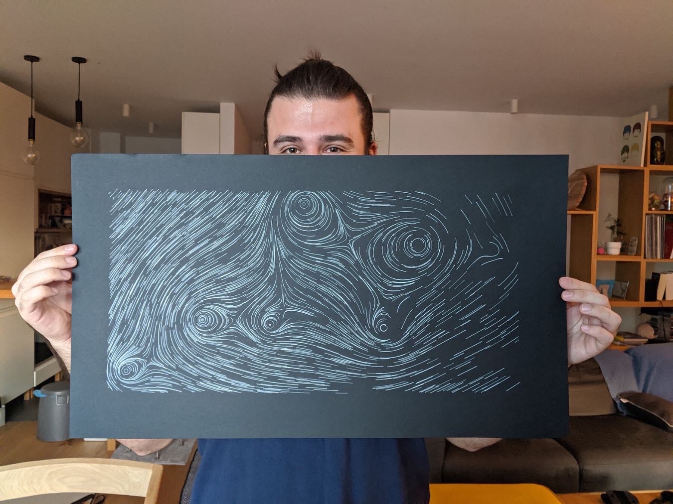 Me holding my generative piece "Black Holes"