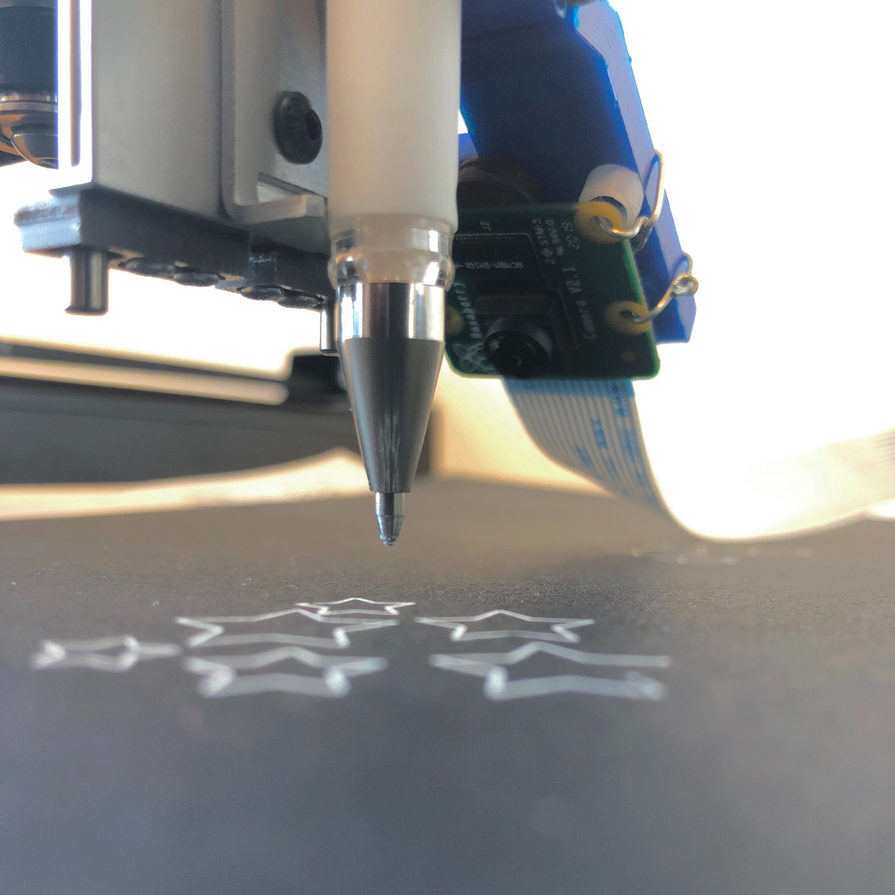 The contraption mounted on AxiDraw plotter