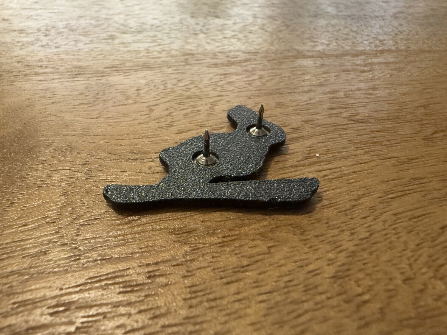 The back side of the brooch with the 3D printed frame